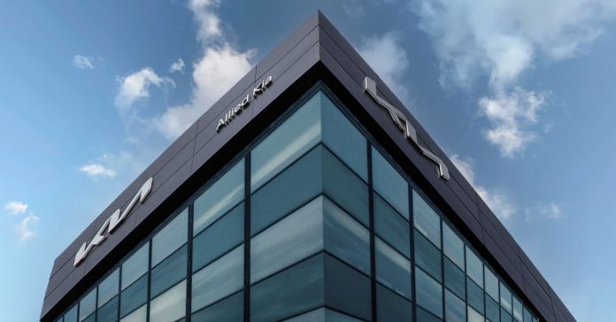Kia dealership building with glass façade and ACP cladding