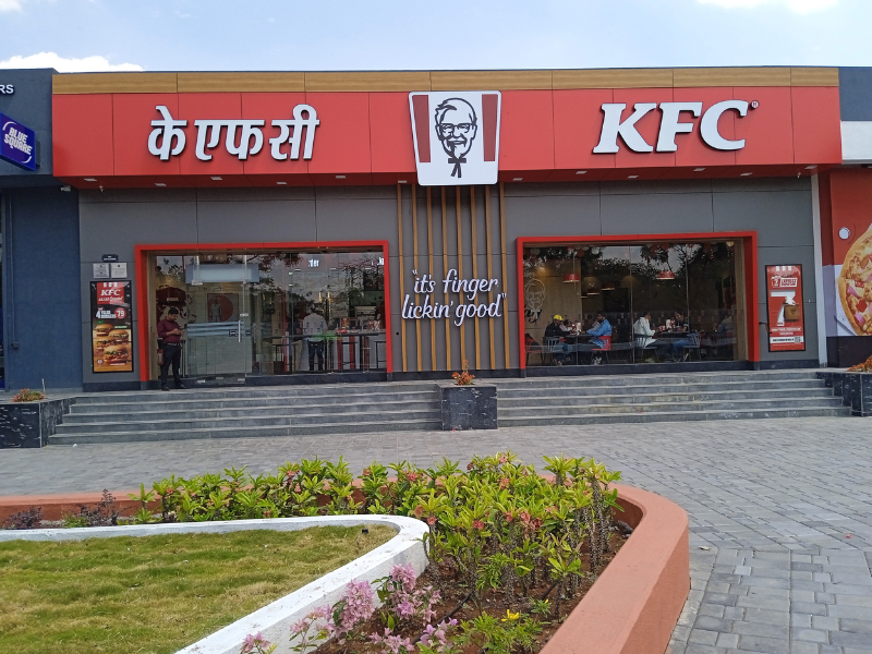 Sleek modern retail façade featuring premium ACP panels with glass frontage and bold branding, showcasing contemporary design and high-end visual appeal.